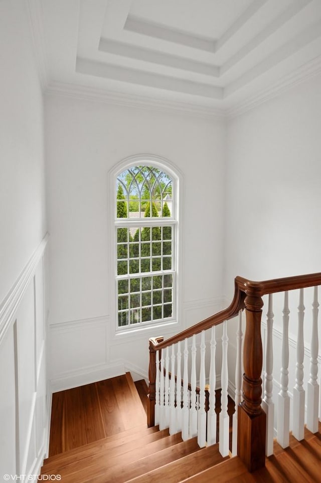 78 Wagner Rd, Northfield, IL 60093 - staircase featuring a raised ceiling, wood finished floors, and a decorative wall