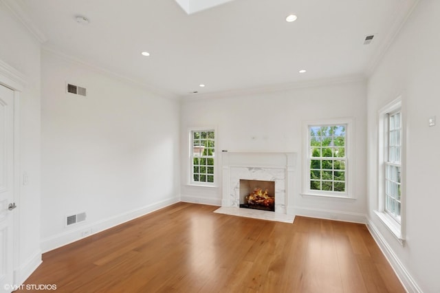 78 Wagner Rd, Northfield, IL 60093 - unfurnished living room featuring plenty of natural light, wood finished floors, ornamental molding, a high end fireplace, and recessed lighting
