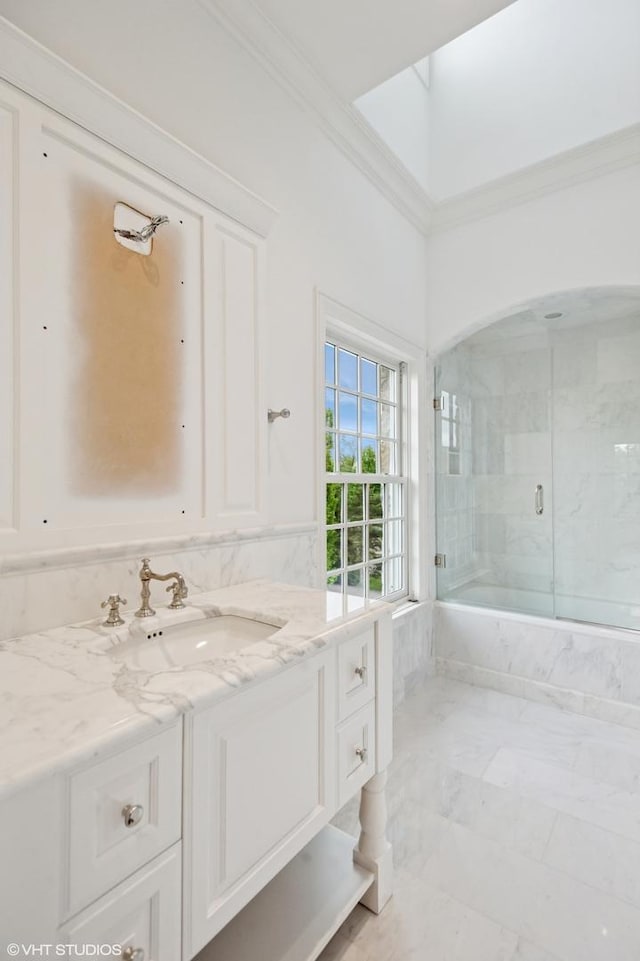 78 Wagner Rd, Northfield, IL 60093 - full bath featuring ornamental molding, vanity, a tub with marble appearance, and a marble finish shower