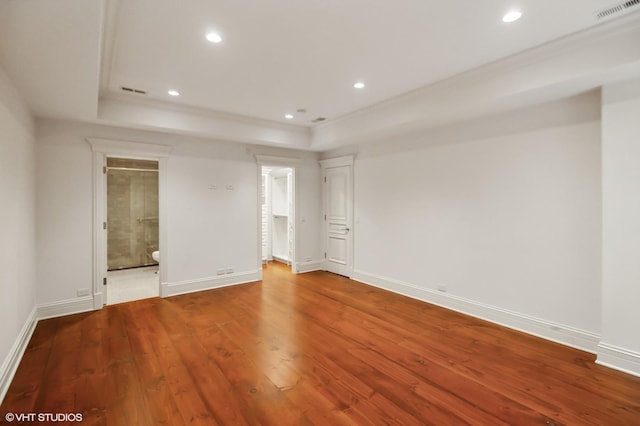 78 Wagner Rd, Northfield, IL 60093 - unfurnished bedroom with hardwood / wood-style floors, a tray ceiling, recessed lighting, and ensuite bath