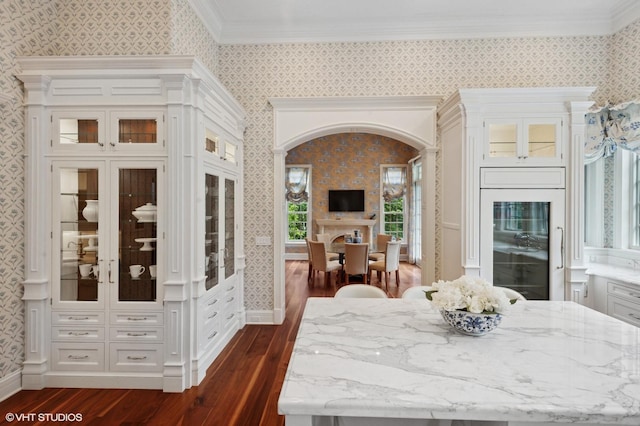 78 Wagner Rd, Northfield, IL 60093 - dining room with wallpapered walls, wine cooler, dark wood finished floors, and ornamental molding