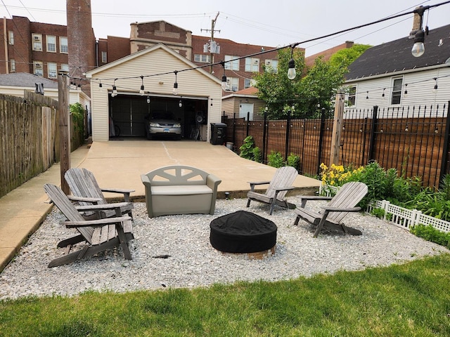 1718 N Kimball Ave, Chicago, IL 60647 - view of patio / terrace with a fire pit, a detached garage, and an outdoor structure