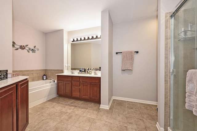 2131 Claremont Ln, Lake In The Hills, IL 60156 - bathroom featuring double vanity, a shower stall, a bath, and tile patterned floors
