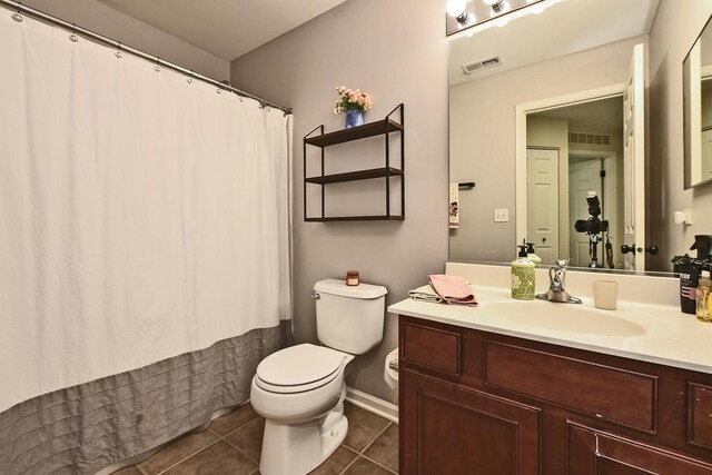 2131 Claremont Ln, Lake In The Hills, IL 60156 - bathroom featuring vanity, tile patterned floors, and a shower with curtain