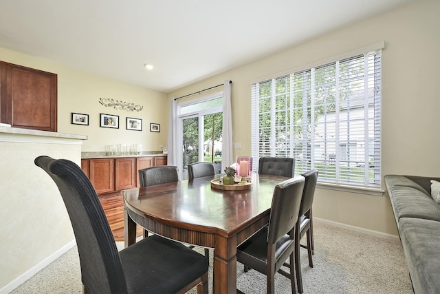 2131 Claremont Ln, Lake In The Hills, IL 60156 - dining area with light carpet and plenty of natural light
