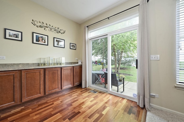 2131 Claremont Ln, Lake In The Hills, IL 60156 - bar area with baseboards and light wood-style flooring