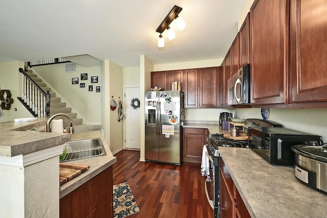2131 Claremont Ln, Lake In The Hills, IL 60156 - kitchen featuring stainless steel appliances and dark wood finished floors