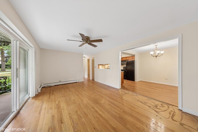 935 8th Ave Unit 1, La Grange, IL 60525 - spare room featuring light wood-style flooring, a chandelier, a baseboard heating unit, and ceiling fan