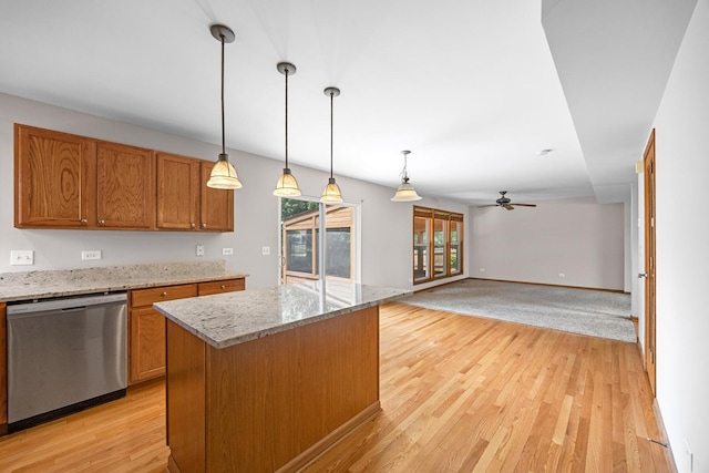 1301 Bridgehampton Dr, Plainfield, IL 60586 - kitchen featuring stainless steel dishwasher, a ceiling fan, light wood-type flooring, and brown cabinetry