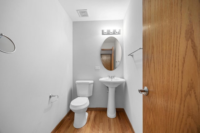1301 Bridgehampton Dr, Plainfield, IL 60586 - half bath with wood finished floors and toilet
