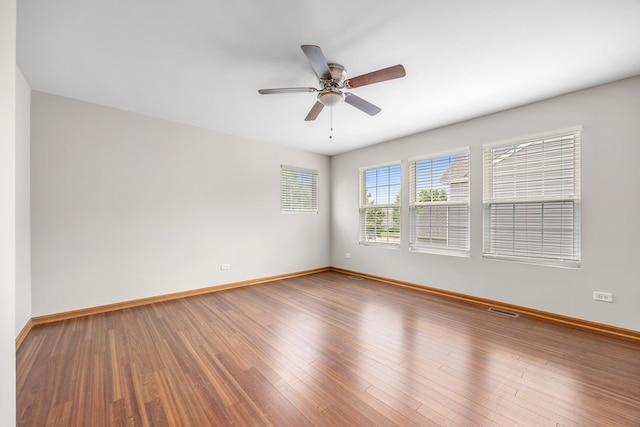 1301 Bridgehampton Dr, Plainfield, IL 60586 - empty room featuring ceiling fan and wood finished floors