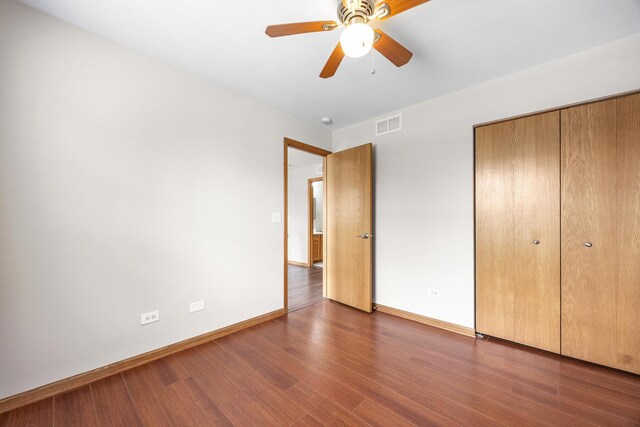 1301 Bridgehampton Dr, Plainfield, IL 60586 - unfurnished bedroom with wood finished floors, a closet, and a ceiling fan