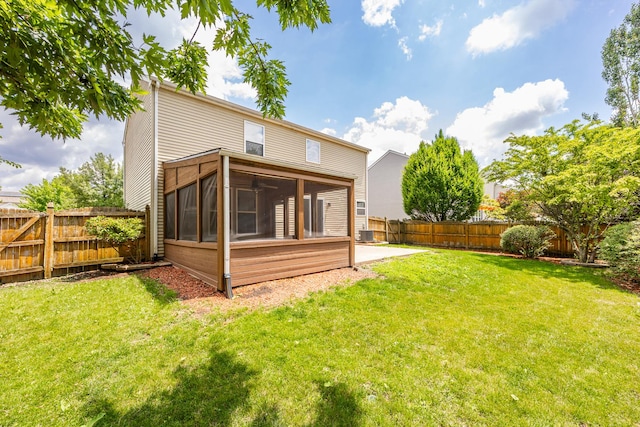 1301 Bridgehampton Dr, Plainfield, IL 60586 - back of house with a sunroom, a fenced backyard, and a patio
