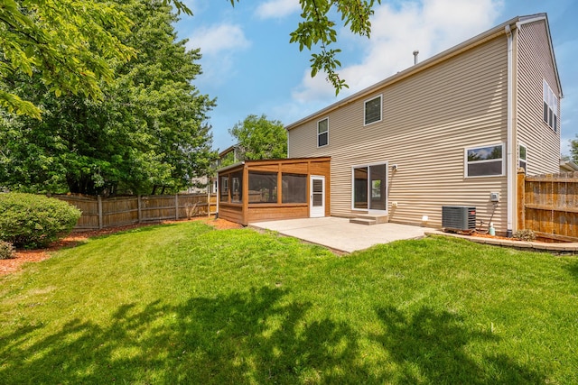 1301 Bridgehampton Dr, Plainfield, IL 60586 - rear view of house with a sunroom, a patio, and a fenced backyard