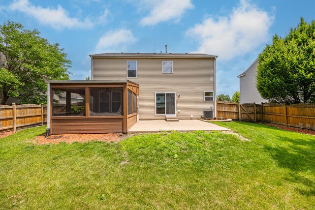 1301 Bridgehampton Dr, Plainfield, IL 60586 - back of house with a patio area, a sunroom, and a fenced backyard