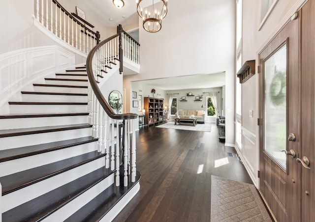 1551 Daybreak Dr, Libertyville, IL 60048 - foyer entrance with stairway, a towering ceiling, dark wood-style floors, and a chandelier