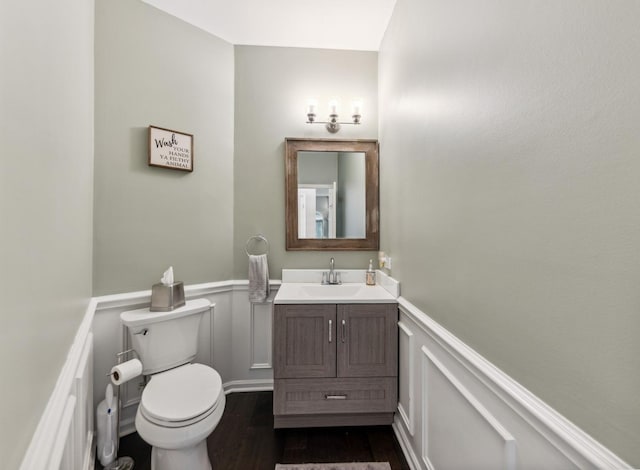 1551 Daybreak Dr, Libertyville, IL 60048 - bathroom with wainscoting, vanity, wood finished floors, and a decorative wall