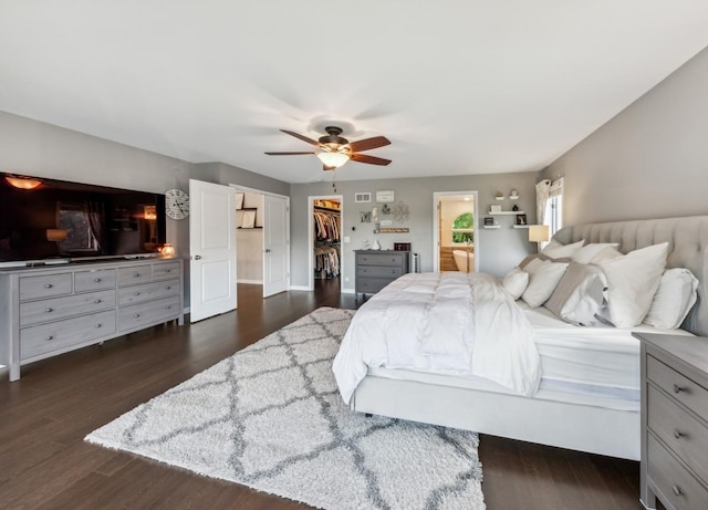 1551 Daybreak Dr, Libertyville, IL 60048 - bedroom with dark wood-type flooring, a walk in closet, a ceiling fan, and a closet
