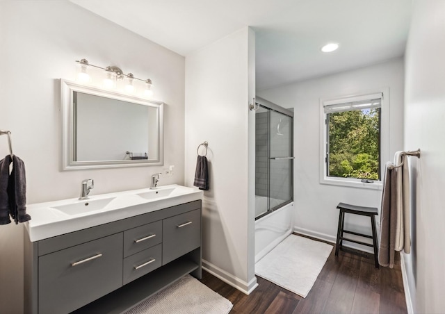 1551 Daybreak Dr, Libertyville, IL 60048 - full bathroom with wood finished floors, double vanity, combined bath / shower with glass door, and recessed lighting
