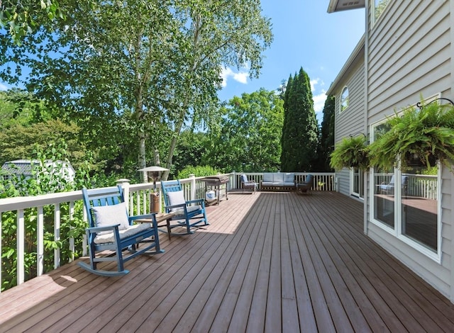 1551 Daybreak Dr, Libertyville, IL 60048 - wooden terrace with view of wooded area and an outdoor living space