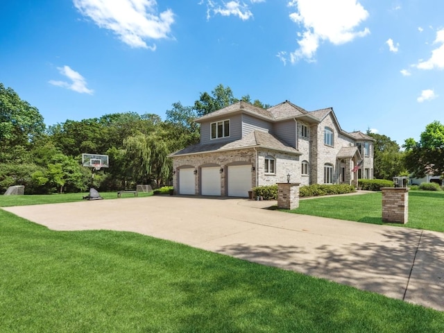 1551 Daybreak Dr, Libertyville, IL 60048 - view of front of property with an attached garage, a front yard, brick siding, and concrete driveway