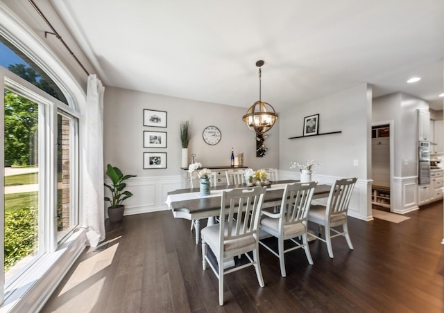 1551 Daybreak Dr, Libertyville, IL 60048 - dining room featuring dark wood-style floors, a chandelier, a wainscoted wall, recessed lighting, and a decorative wall