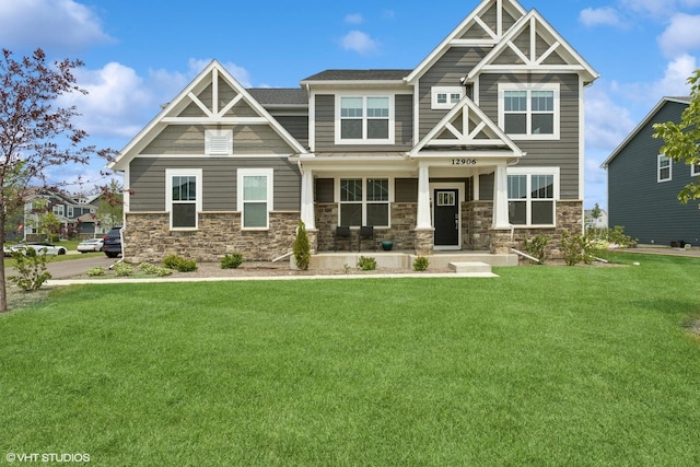 12906 S Sydney Cir, Plainfield, IL 60585 - craftsman house with stone siding, a front lawn, and covered porch