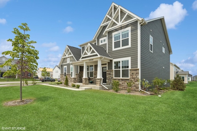 12906 S Sydney Cir, Plainfield, IL 60585 - craftsman-style house featuring covered porch, a front lawn, and stone siding