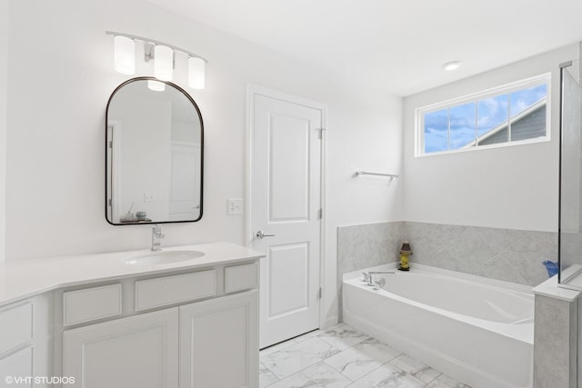 12906 S Sydney Cir, Plainfield, IL 60585 - bathroom featuring a garden tub, marble finish floors, and vanity