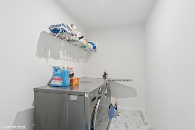 12906 S Sydney Cir, Plainfield, IL 60585 - laundry area with washing machine and dryer and light marble finish floors