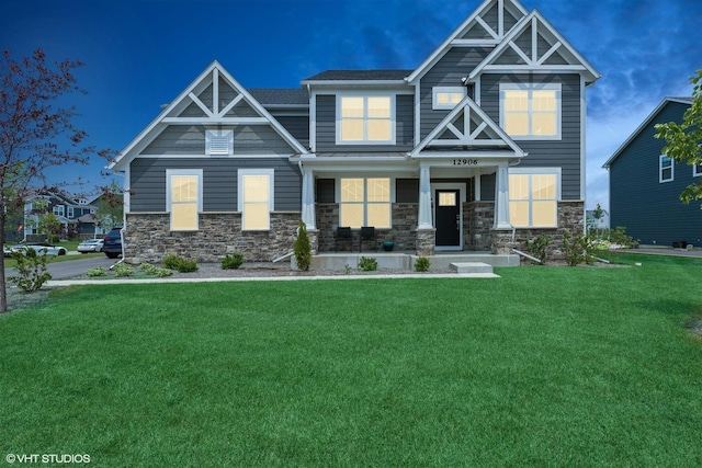 12906 S Sydney Cir, Plainfield, IL 60585 - craftsman-style home featuring a front lawn, covered porch, and stone siding