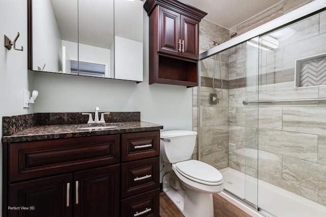 6525 Main St Unit 204, Downers Grove, IL 60516 - bathroom with a shower stall, vanity, and wood finished floors