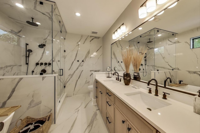 2902 N Seeley Ave, Chicago, IL 60618 - full bath featuring a marble finish shower, double vanity, marble tiled floors, and recessed lighting