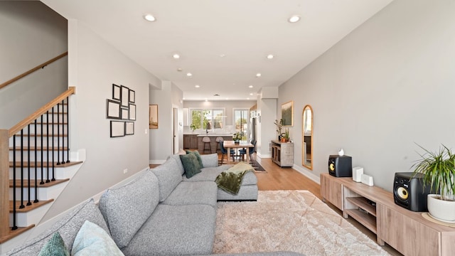 3124 S Benson St Unit 6, Chicago, IL 60608 - living room featuring stairway, light wood-style flooring, and recessed lighting