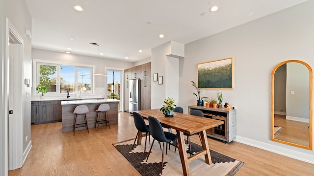 3124 S Benson St Unit 6, Chicago, IL 60608 - dining area featuring light wood finished floors, recessed lighting, and arched walkways