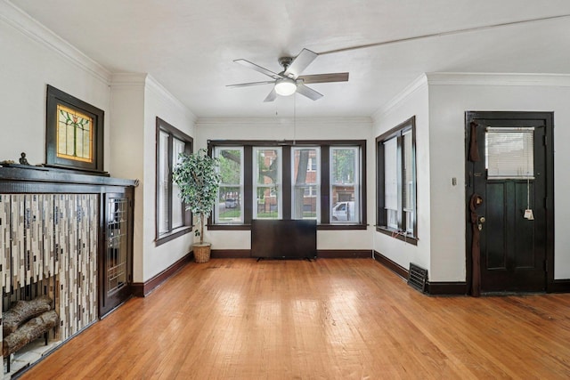7659 S Rhodes Ave, Chicago, IL 60619 - entrance foyer with light wood-style floors, ceiling fan, and ornamental molding