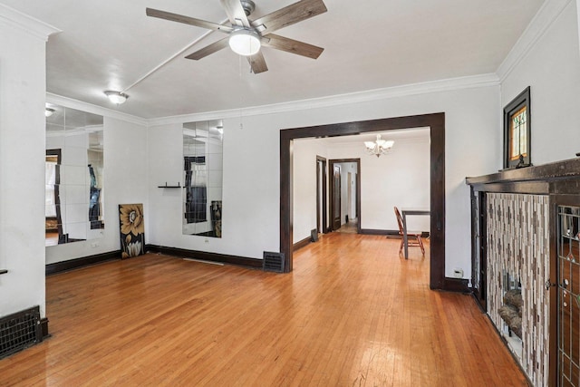 7659 S Rhodes Ave, Chicago, IL 60619 - unfurnished living room featuring a chandelier, crown molding, wood finished floors, and a ceiling fan