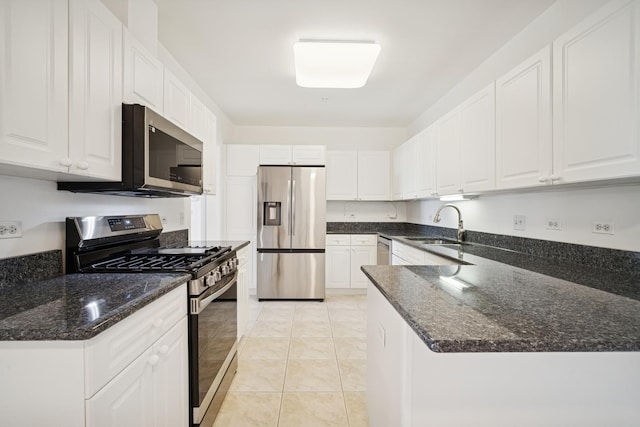 820 Weidner Rd Unit 405, Buffalo Grove, IL 60089 - kitchen featuring stainless steel appliances, white cabinetry, dark stone countertops, and a peninsula