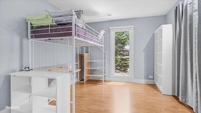 2051 Creekside Dr Unit 2-3, Wheaton, IL 60189 - unfurnished bedroom with light wood-type flooring and baseboards