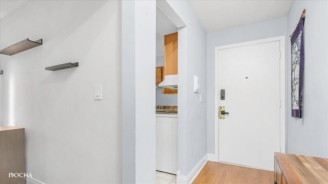 2051 Creekside Dr Unit 2-3, Wheaton, IL 60189 - foyer featuring washer / dryer and light wood finished floors