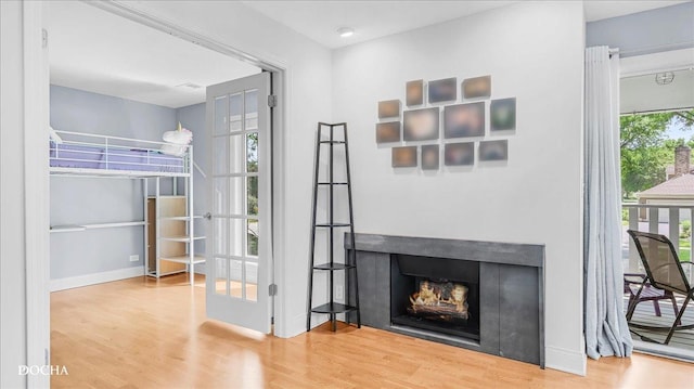 2051 Creekside Dr Unit 2-3, Wheaton, IL 60189 - interior space featuring wood finished floors, a lit fireplace, and access to exterior