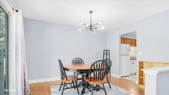 2051 Creekside Dr Unit 2-3, Wheaton, IL 60189 - dining area featuring a chandelier and light wood-style floors