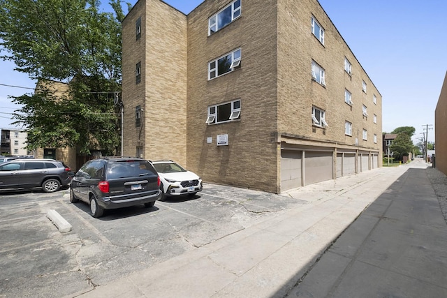 429 Wesley Ave Unit 301, Oak Park, IL 60302 - view of building exterior featuring uncovered parking
