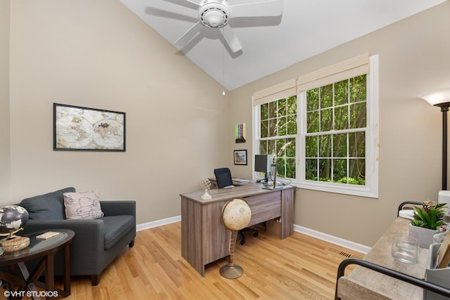 office space with light wood finished floors, ceiling fan, and high vaulted ceiling
