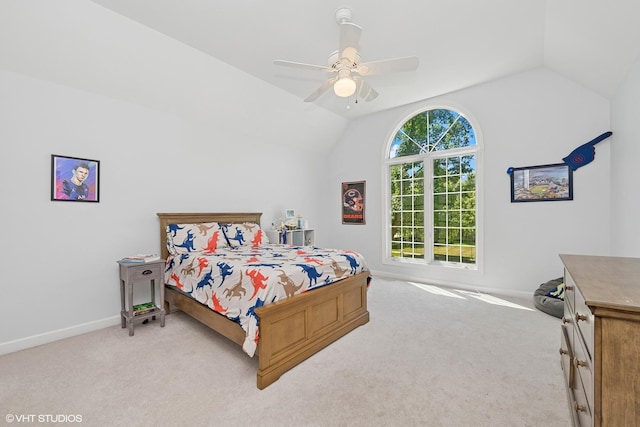 bedroom with lofted ceiling, light colored carpet, and ceiling fan