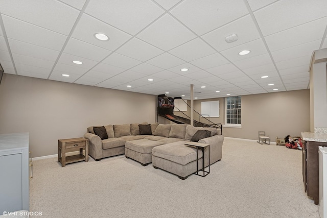 living room with carpet flooring, recessed lighting, and a drop ceiling