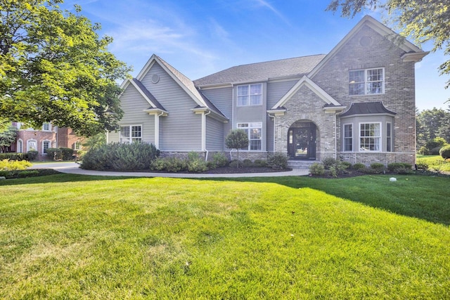 7270 Bannockburn Cir, Lakewood, IL 60014 - view of front of house with a front yard, brick siding, and stone siding
