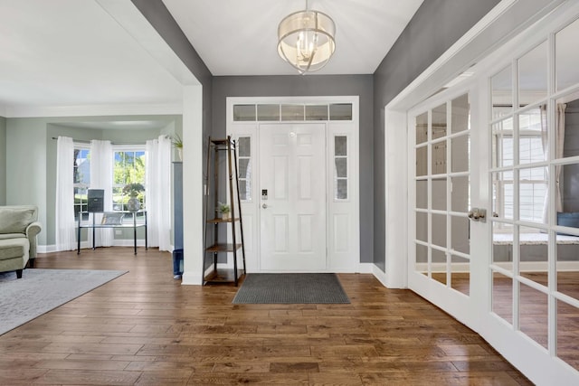 7270 Bannockburn Cir, Lakewood, IL 60014 - entrance foyer with dark wood-type flooring and a chandelier