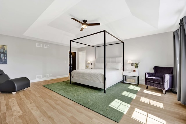 7270 Bannockburn Cir, Lakewood, IL 60014 - bedroom with a raised ceiling, wood finished floors, and ceiling fan
