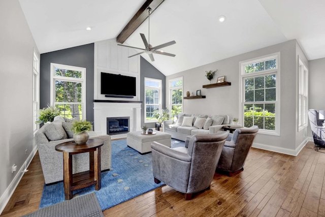 7270 Bannockburn Cir, Lakewood, IL 60014 - living room featuring ceiling fan, beamed ceiling, wood-type flooring, a large fireplace, and high vaulted ceiling